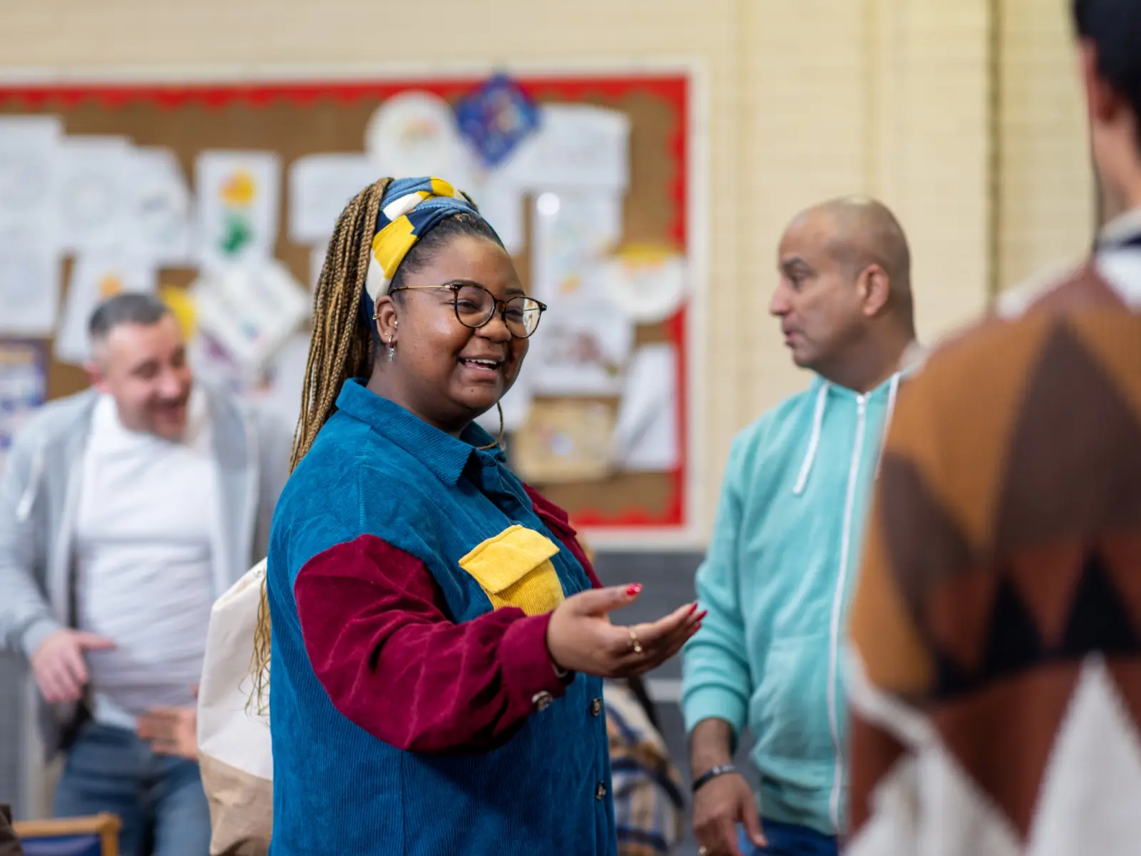 Image of women speaking to group at community center.