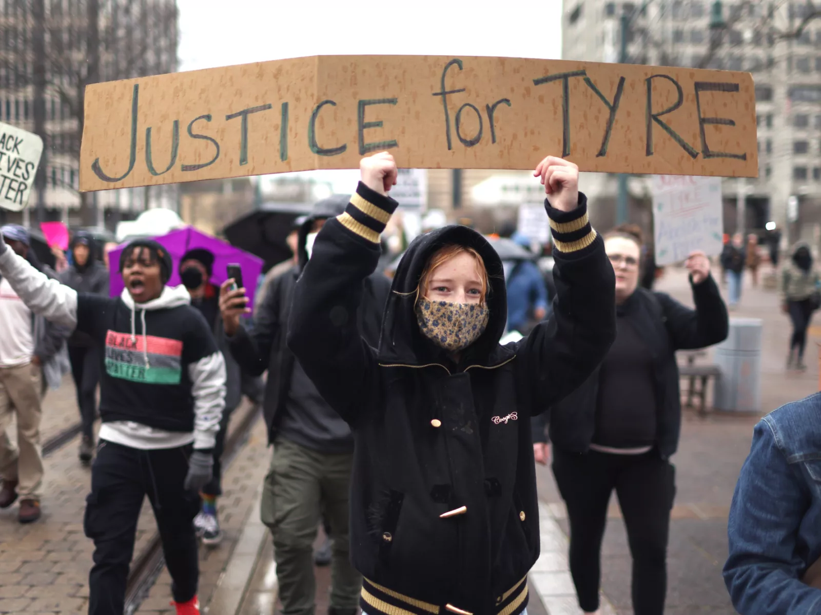 Demonstrators marching in protest.