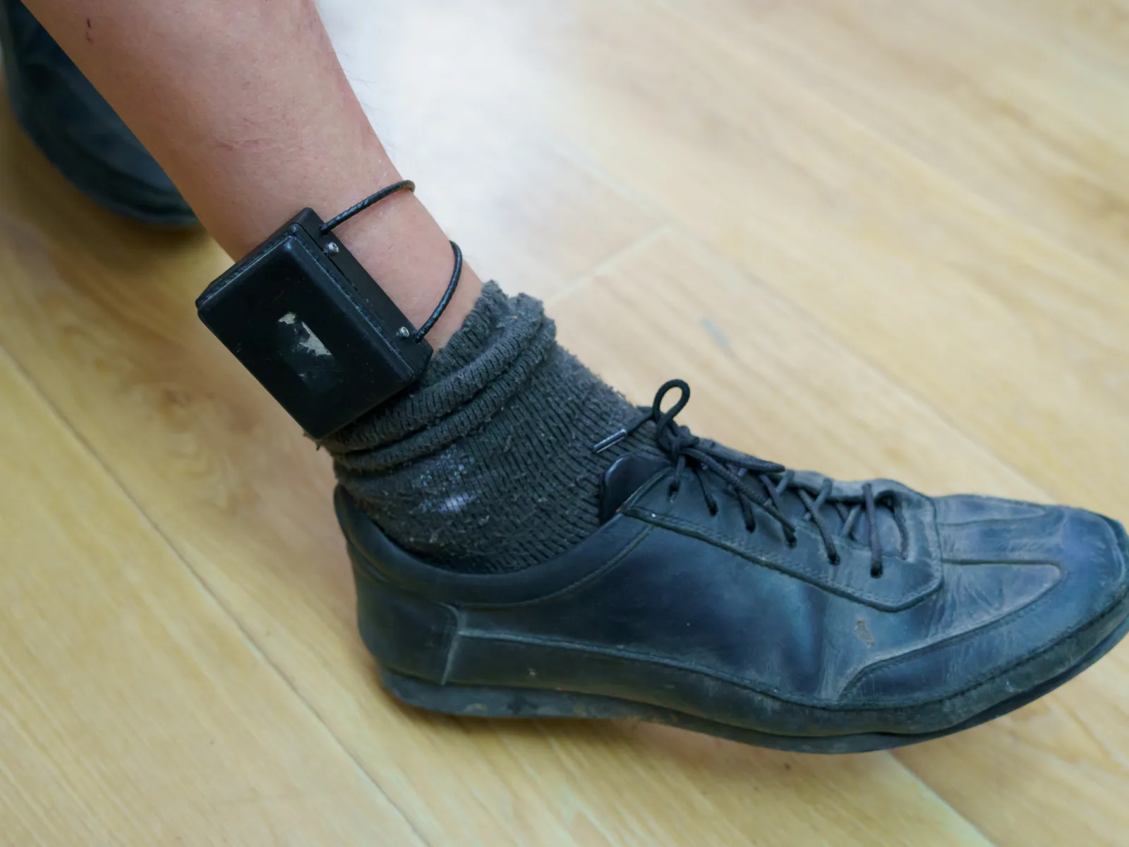 Image of electronic monitor on ankle.