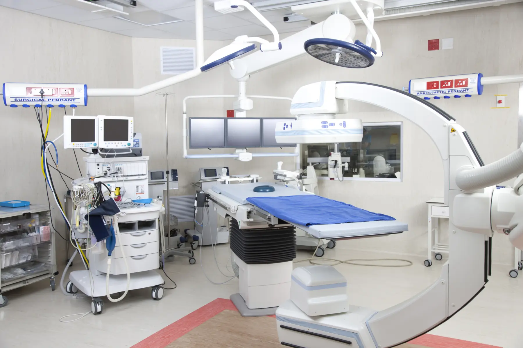 Hospital room with robotic operating machine.